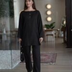 Black solid cord-set trouser pocket. Branded stitching full suit over lock